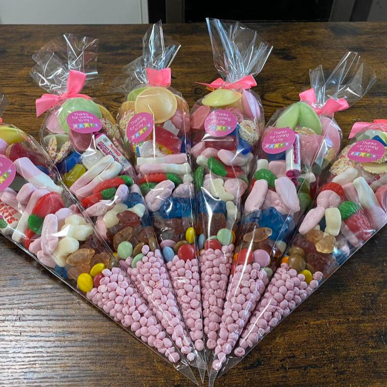 Custom sweet cones containing a variety of colourful sweets.