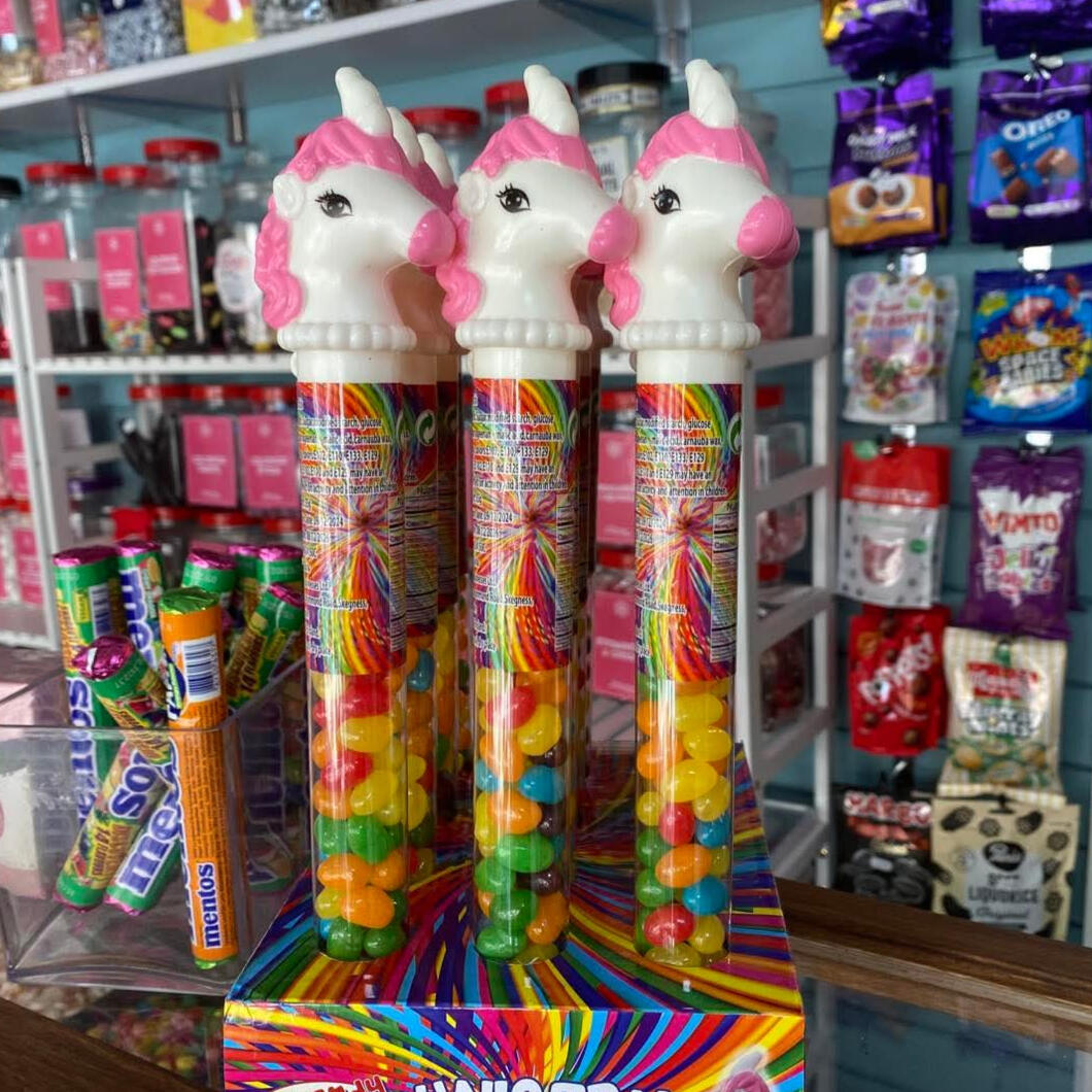 Pink unicorn toys with jelly beans inside.
